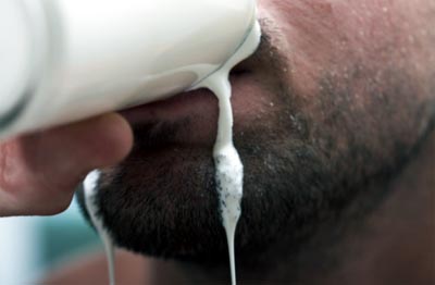 man drinking milk